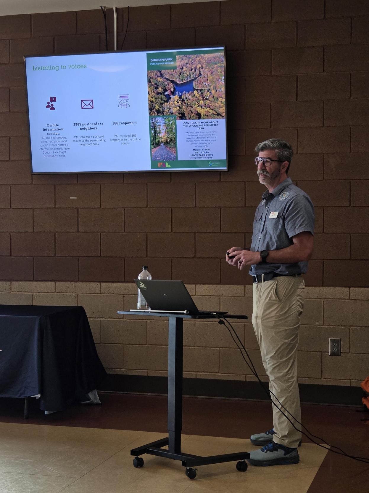 Ben Lea, PAL Trails Outreach Coordinator, presents information to the group.